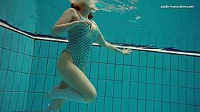 Dasha comes into frame naked and begins to get into the shower and slide the curtain shut-only to jump back out quickly to retrieve a towel