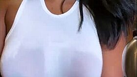 Thus, in the culinary setting Pena Torres moists her attire and shows her natural breasts